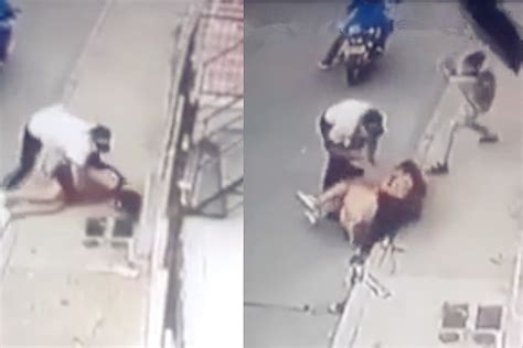 监拍：哥伦比亚一女子遭劫匪袭击抱摔 8岁儿子抡起雨伞救母！_凤凰网视频_凤凰网