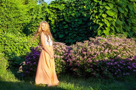 Premium Photo | Young girl standing and enjoying on summertime
