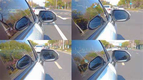 行驶在城市道路街道的汽车后视镜向外视角镜头视频素材_ID:VCG2213262475-VCG.COM