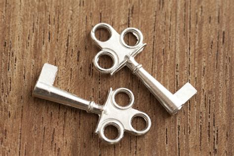 Free Stock Photo 12731 Two short silver keys with single flat end | freeimageslive