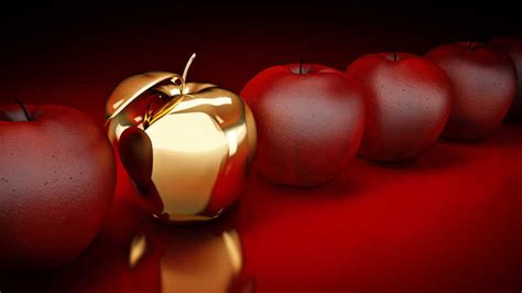 黄金苹果图片-暗红色背景前的黄金苹果素材-高清图片-摄影照片-寻图免费打包下载
