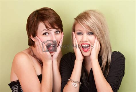 Two attractive teen girls screaming by Creatista Vectors ...
