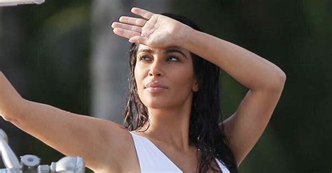 Kim Kardashian flashes boobs in wet t-shirt as star gets wild on the ...