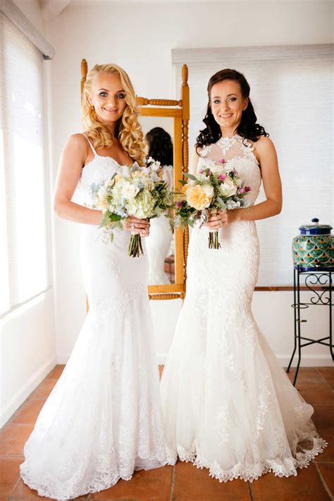 Two Brides Pose with Bouquets
