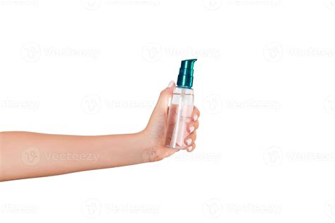 Female hand holding cream bottle of lotion isolated. Girl give tube ...