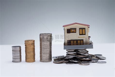 赚钱房地产金融硬币和房屋模型高清图片下载-正版图片501938383-摄图网