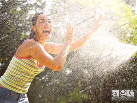 Young woman under water spray, Stock Photo, Picture And Royalty Free ...