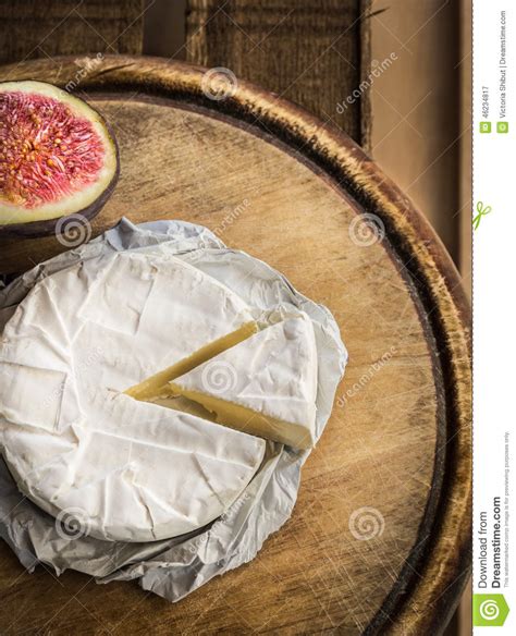 Camembert Cheese on Old Wooden Board Stock Image - Image of piece, ripe ...