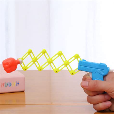 儿童玩具枪 创意伸缩拳头枪 迷你搞怪弹力枪 弹簧魔术枪小玩具-阿里巴巴