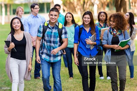 Diverse Group Of College Students Walking On Beautiful Campus Stock ...