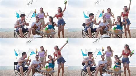 一群亚洲年轻男女在海滩上聚会。迷人的快乐朋友旅行者在海边露营时唱歌跳舞，享受热带海岛的假日度假之旅_3840X2160_高清视频素材下载(编号 ...