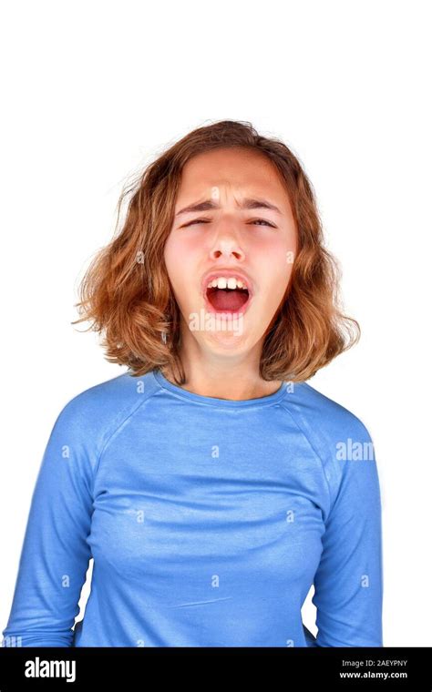 Teenager girl in classic blue T-shirt screams in pain with her mouth ...