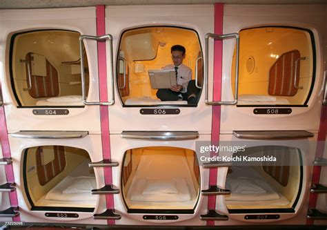 A visitor relaxes in a sleeping module at Tokyo