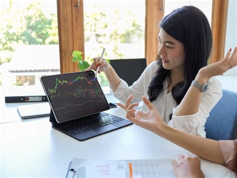 Female Financial Analysts Analysing Stock Market Graph Stock Photo ...