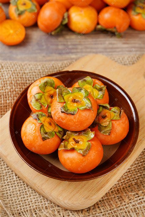 秋季果实新鲜软柿子水果摄影图配图高清摄影大图-千库网