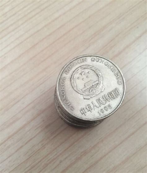 现在流通的人民币中一元硬币的背面的图案是什么花-金投外汇网-金投网