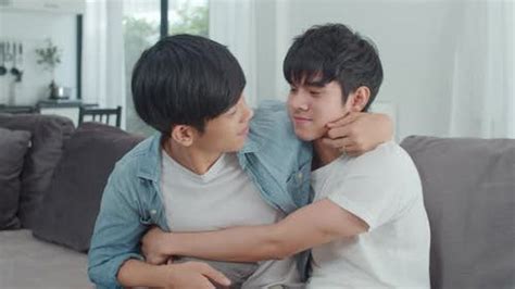Young Asian Gay couple hug and kiss at home., Stock Video - Envato Elements
