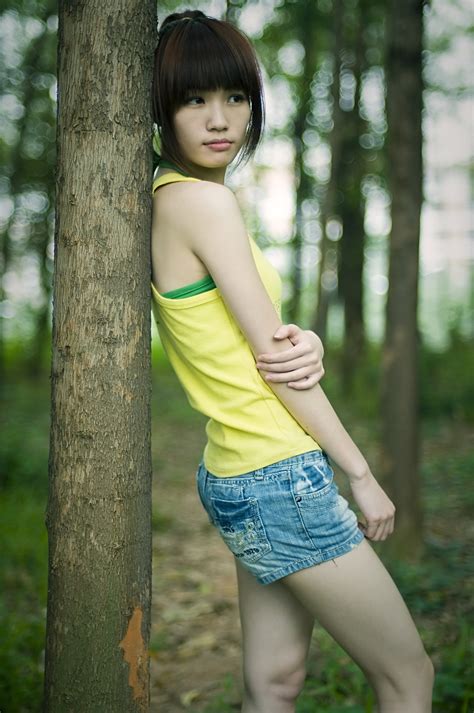 Girl Pretty | Free Stock Photo | A beautiful Chinese girl posing against a tree | # 9430