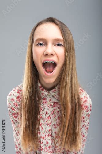 "Cute blonde teen screams at camera" Stock photo and royalty-free ...