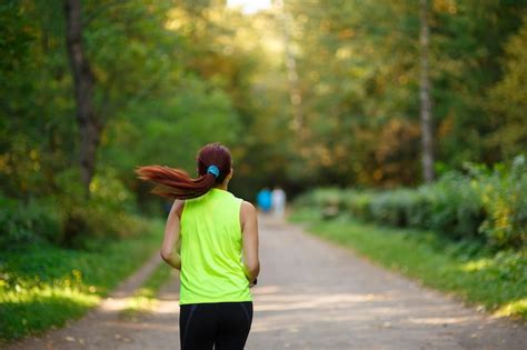 Premium Photo | Woman running at forest