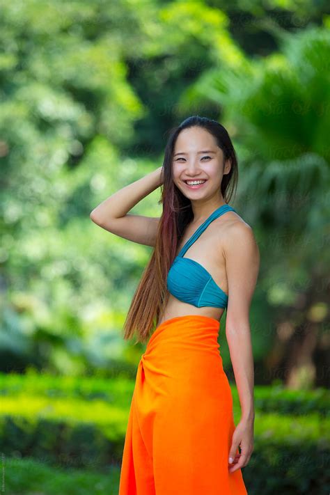 "Pretty Young Asian Or Chinese Woman Wearing Bikini In The Garden" by ...