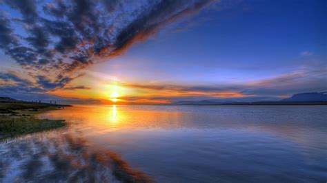 海滩边美丽的夕阳自然风光摄影图片 - 三原图库