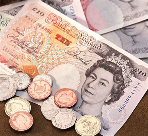 英国英镑货币纸币和硬币高清摄影大图-千库网