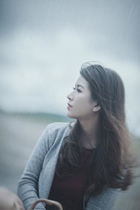 Long hair Asian woman looking aside free image download