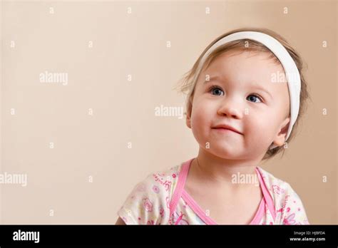 Baby Girl Thinking Stock Photo - Alamy