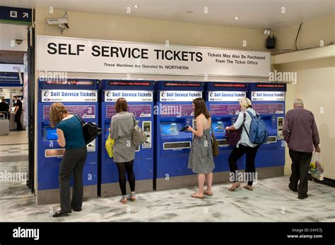 Passengers buying tickets from automated ticket machines at Leeds ...