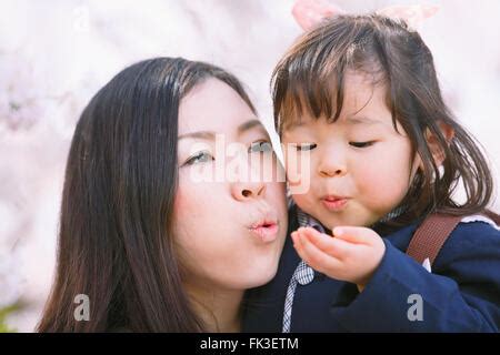 Japanese mom and daughter enjoying the cherry blossoms Stock Photo ...
