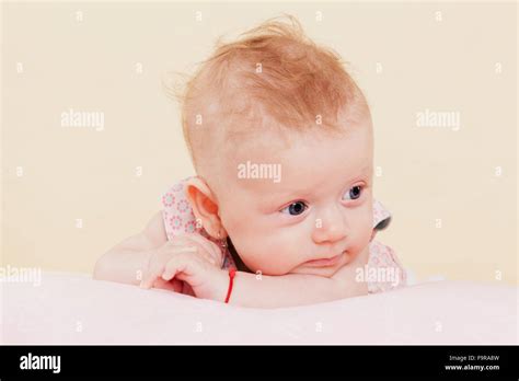 Baby girl thinking Stock Photo - Alamy