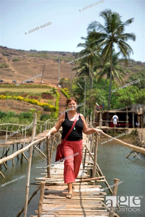 Woman crossing a simple bridge, India, Stock Photo, Picture And Royalty ...