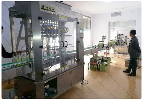 瓶装液体灌装设备生产线-某橄榄油加工生产企业研发设备_郑州星火包装机械有限公司