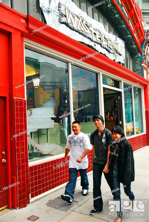Three friends walk past the Avant Guarde stores of the Haight Ashbury ...