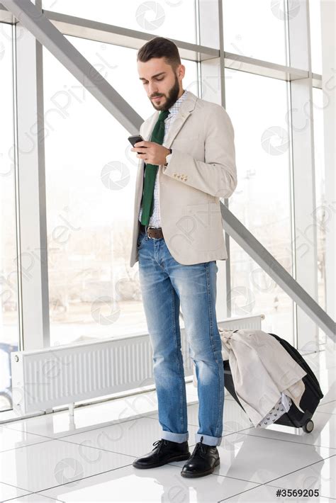 Modern Man Checking Messages in Airport - stock photo 3569205 | Crushpixel