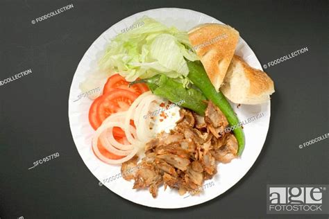 Döner meat with vegetables and flatbread on paper plate, Stock Photo ...